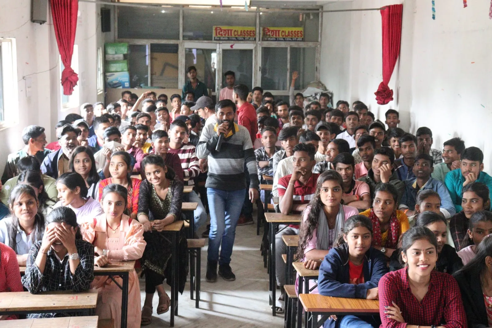 Students sitting together with books